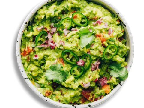 Bowl of fresh guacamole topped with sliced jalapenos and cilantro at El Agave